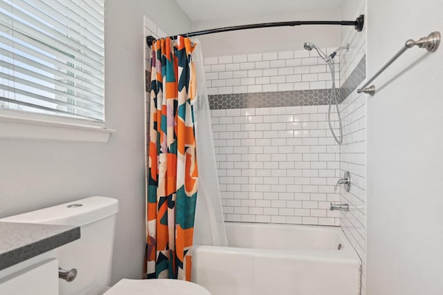 full bathroom featuring toilet, vanity, and shower / bathtub combination with curtain