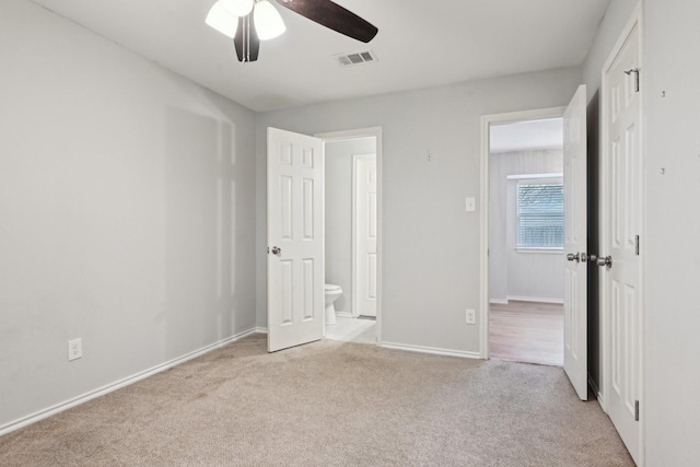 3404 Peachtree Ln, Pantego, TX 76013 - unfurnished bedroom with light carpet, ensuite bath, baseboards, and a ceiling fan