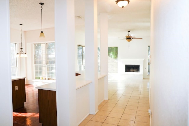 corridor featuring light tile patterned flooring