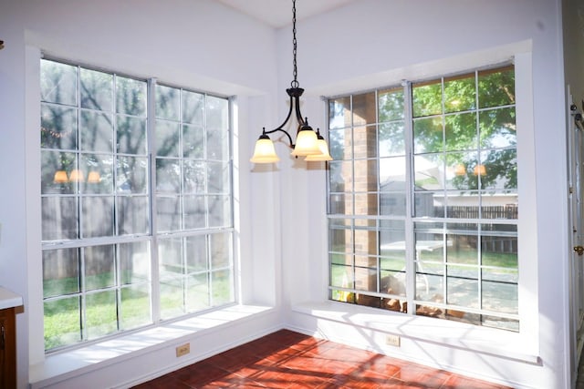 unfurnished dining area featuring an inviting chandelier