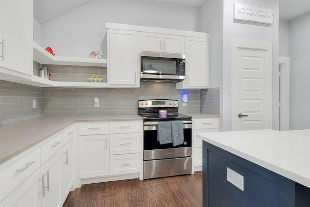 kitchen with tasteful backsplash, appliances with stainless steel finishes, dark hardwood / wood-style floors, and white cabinets