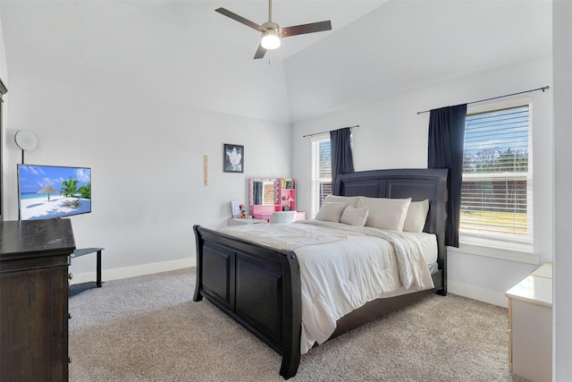 bedroom with vaulted ceiling, light colored carpet, and ceiling fan