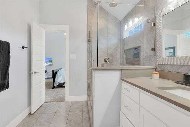 bathroom featuring vanity and a shower with door