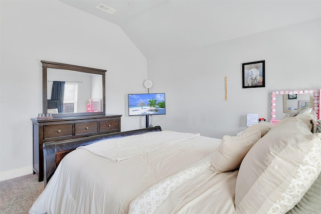 bedroom featuring light carpet and lofted ceiling