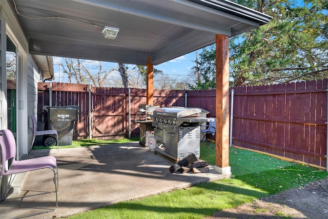 view of patio featuring a grill