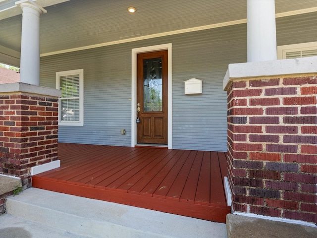 entrance to property featuring a porch