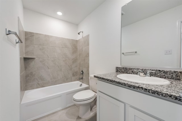 full bathroom with tiled shower / bath combo, vanity, tile patterned flooring, and toilet