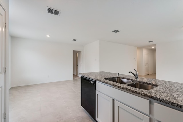 kitchen featuring sink, white cabinets, stone countertops, and dishwasher