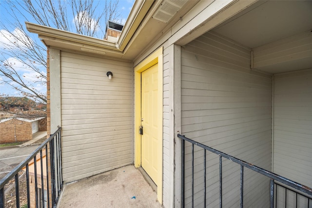 doorway to property featuring a balcony