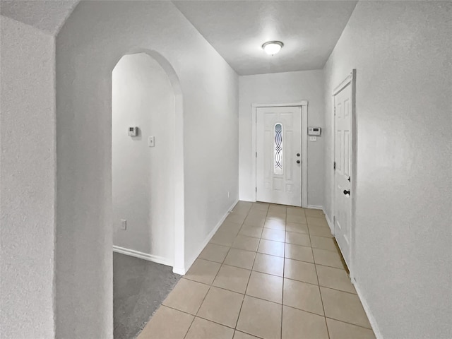 foyer featuring light tile patterned flooring