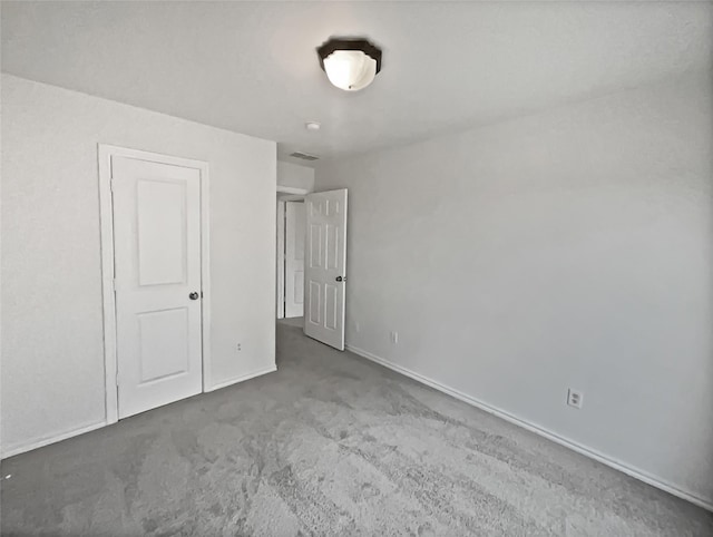 unfurnished bedroom with carpet floors