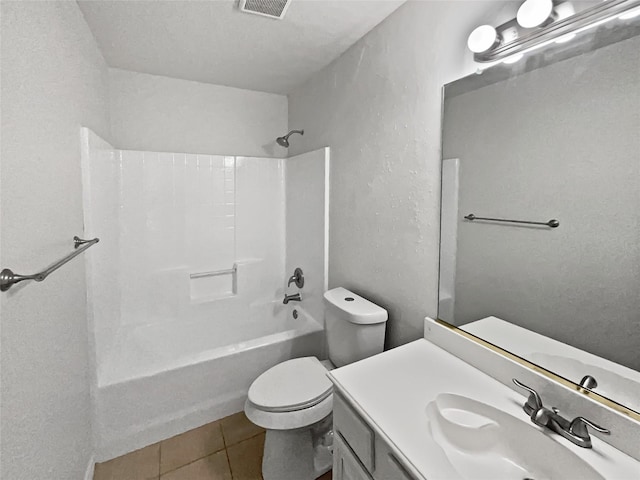 full bathroom featuring vanity, tile patterned floors, toilet, and washtub / shower combination