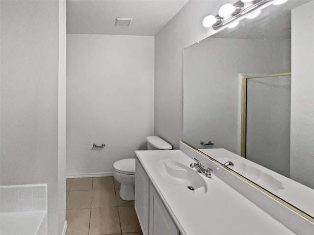 full bathroom featuring vanity, shower with separate bathtub, tile patterned floors, and toilet