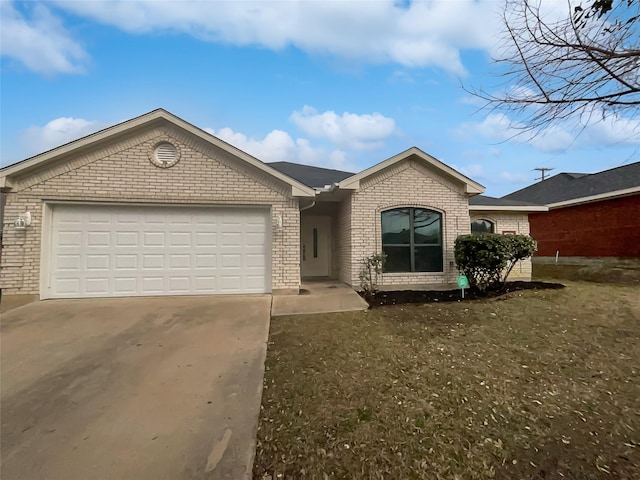 ranch-style home with a garage and a front lawn