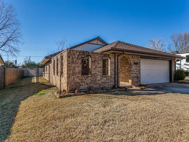 ranch-style home with a garage and a front yard