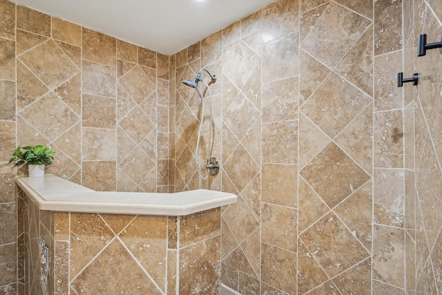 bathroom featuring tiled shower