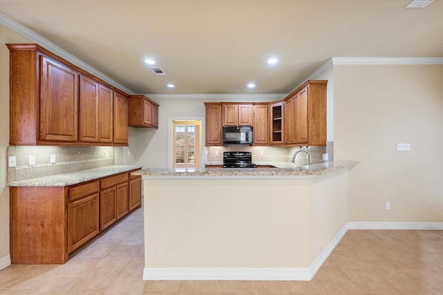 kitchen featuring light stone counters, ornamental molding, black appliances, and kitchen peninsula