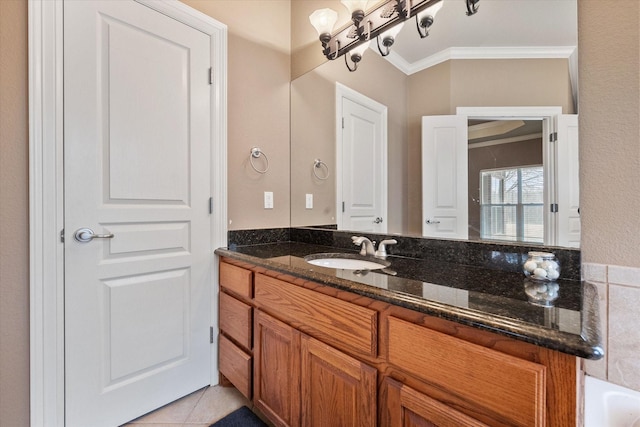 bathroom with vanity, a notable chandelier, tile patterned flooring, and ornamental molding