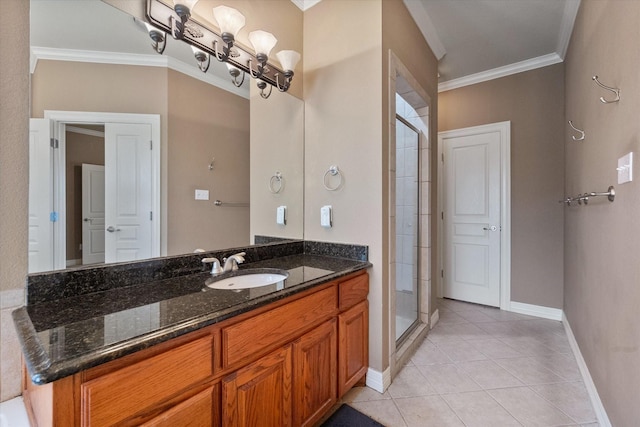 bathroom featuring ornamental molding, vanity, a notable chandelier, a shower with door, and tile patterned floors