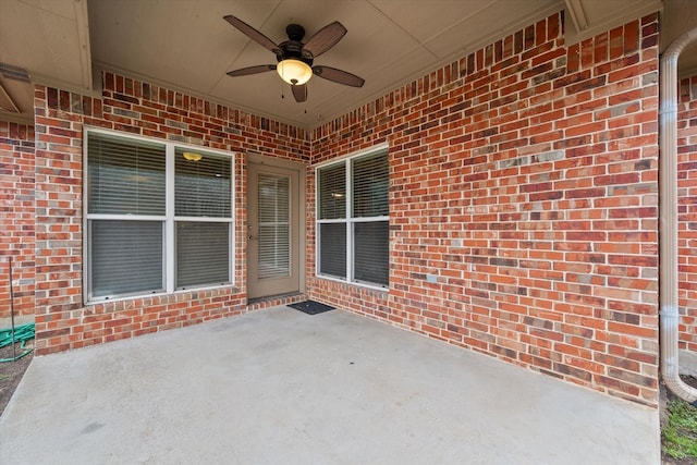 view of patio featuring ceiling fan