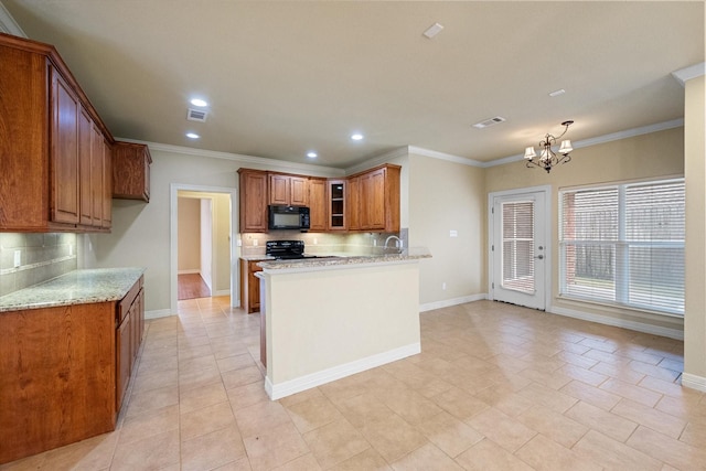 kitchen featuring visible vents, brown cabinets, a notable chandelier, black appliances, and decorative backsplash