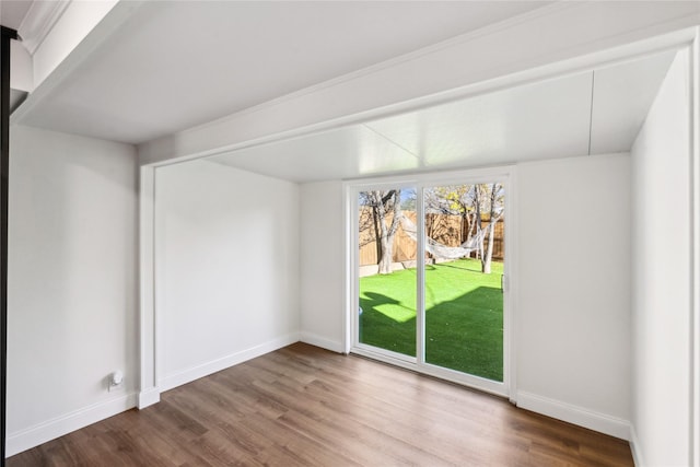 unfurnished room featuring wood-type flooring