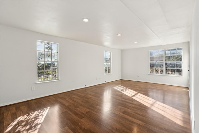 empty room with hardwood / wood-style flooring