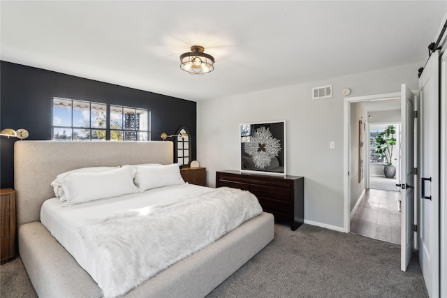 carpeted bedroom featuring multiple windows