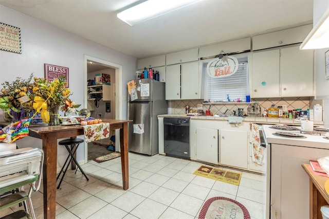 kitchen featuring backsplash, white range with electric cooktop, light countertops, black dishwasher, and freestanding refrigerator