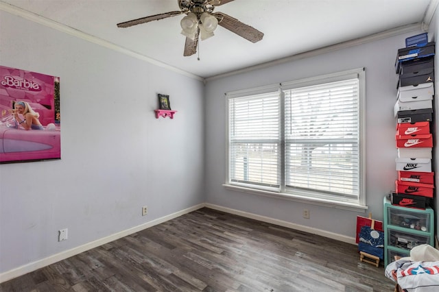 bedroom featuring crown molding, baseboards, and wood finished floors