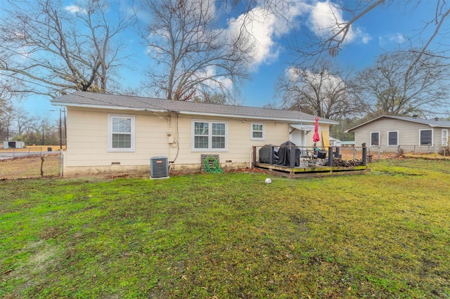 rear view of house featuring a deck, fence, a yard, cooling unit, and crawl space