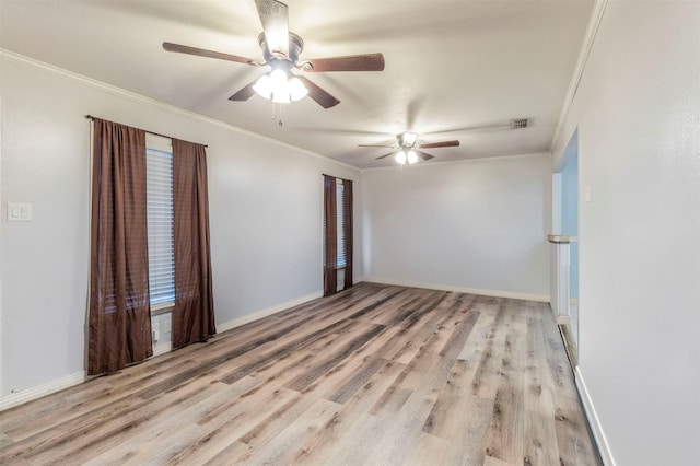 empty room featuring wood finished floors, a ceiling fan, and ornamental molding