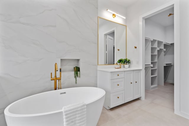 bathroom with a bathing tub and vanity