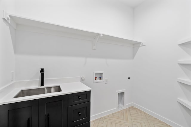 laundry room featuring sink, cabinets, washer hookup, light parquet flooring, and hookup for an electric dryer