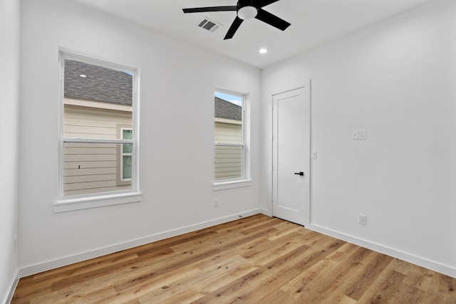 unfurnished room featuring ceiling fan and light hardwood / wood-style floors