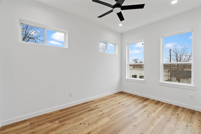 unfurnished room with ceiling fan and light hardwood / wood-style floors