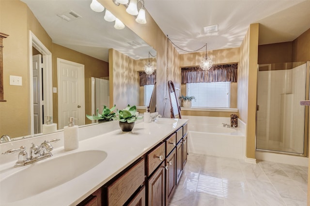 bathroom featuring vanity and shower with separate bathtub