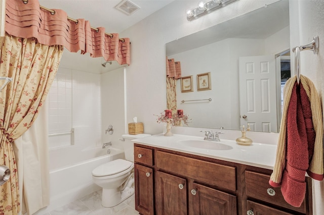 full bathroom with vanity, shower / tub combo, and toilet