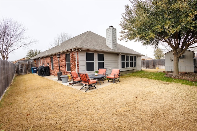 rear view of property with a patio