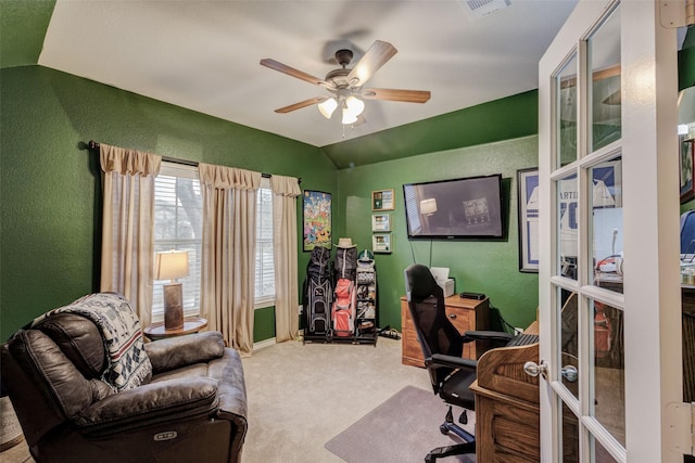 carpeted home office with lofted ceiling, french doors, and ceiling fan