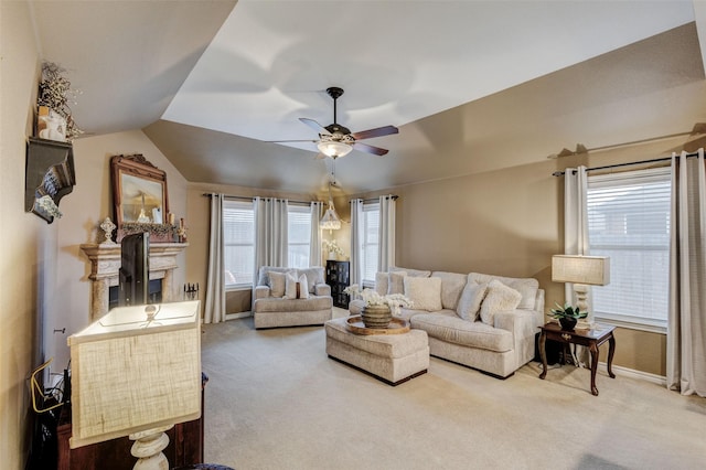 carpeted living room with vaulted ceiling and ceiling fan