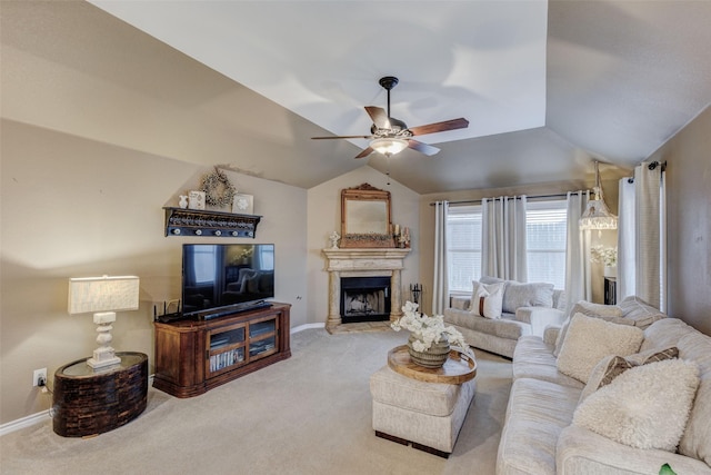 carpeted living room featuring ceiling fan and vaulted ceiling