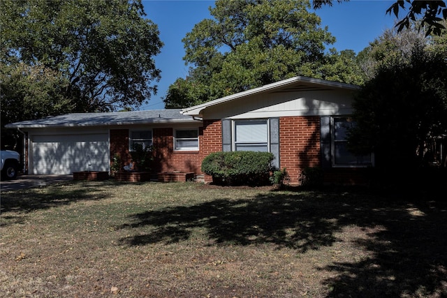 ranch-style home with a garage and a front yard