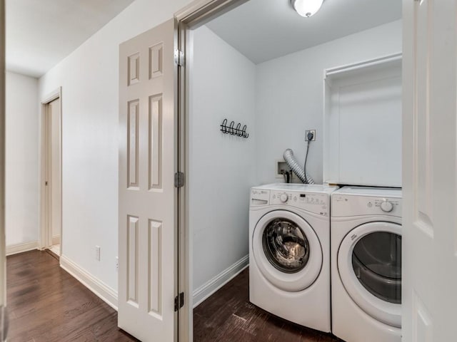 laundry room with separate washer and dryer and dark wood-type flooring