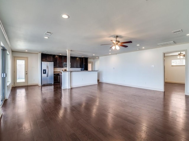 unfurnished living room with dark wood-type flooring and ceiling fan