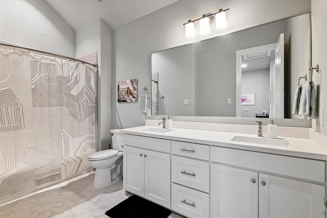 bathroom featuring vanity, toilet, and a shower with shower curtain