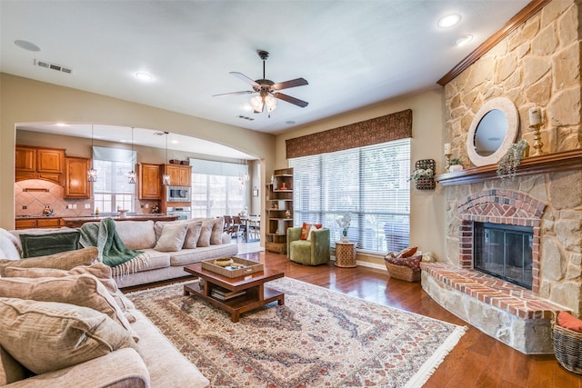 9720 Birdville Way, Fort Worth, TX 76244 - living area featuring ceiling fan, wood finished floors, and a stone fireplace