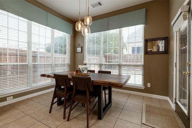 dining space with light tile patterned floors