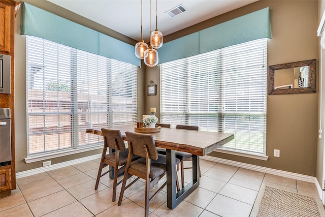 9720 Birdville Way, Fort Worth, TX 76244 - dining space with plenty of natural light, baseboards, and light tile patterned flooring
