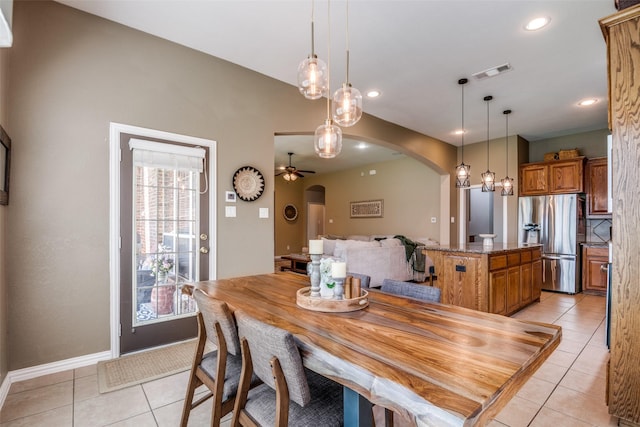 9720 Birdville Way, Fort Worth, TX 76244 - dining space featuring arched walkways, light tile patterned floors, plenty of natural light, recessed lighting, and a ceiling fan